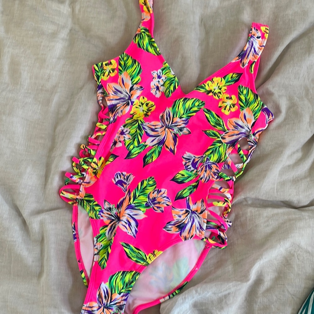 Women’s neon one piece bathing suit.